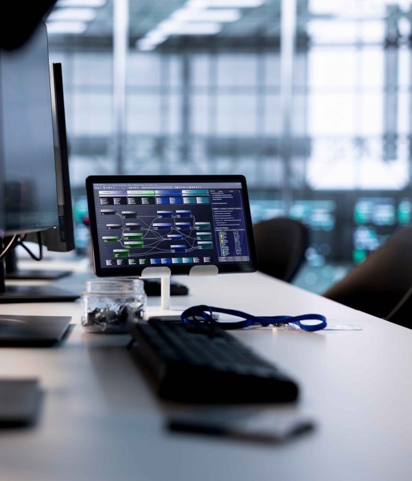 code-running-computer-screens-tablet-empty-data-center (1)